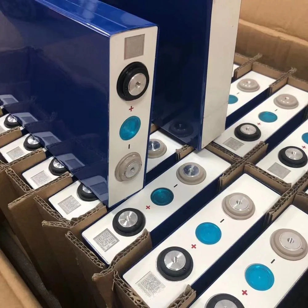 A batch of original EVE LF105 Grade A fresh LiFePO4 prismatic cells in factory packaging, featuring clear QR codes and high-quality blue aluminum casing for reliability in ESS projects.