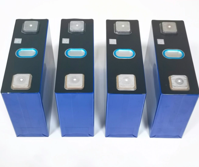 Real-world photo of four REPT CB3914895EA 50Ah LiFePO4 battery cells in blue aluminum casing, highlighting laser-welded terminals and intact factory QR codes.